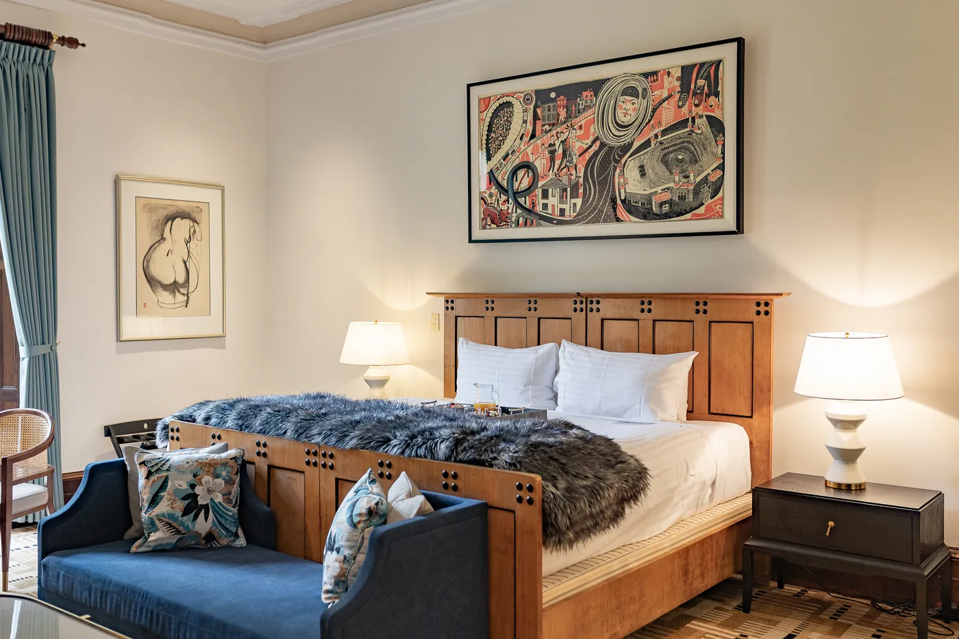 The Signature Room with a carved timber bed and original artwork